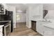 Modern kitchen with stainless steel appliances, white cabinets, and contemporary finishes at 3312 James Rd, Charlotte, NC 28215