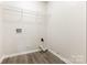 Laundry room with vinyl floors, white walls, and hookups for washer and dryer at 3312 James Rd, Charlotte, NC 28215