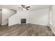 Bright living room featuring modern flooring, a classic fireplace, and ample natural light at 3312 James Rd, Charlotte, NC 28215