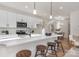 Stylish open concept kitchen featuring quartz countertops, stainless appliances, and modern light fixtures at 3314 & 3316 Cedarhurst Dr, Charlotte, NC 28269
