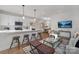 Bright open-concept living room with a large island, stainless appliances and views of the dining area at 3314 & 3316 Cedarhurst Dr, Charlotte, NC 28269