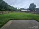 Large backyard with a grass lawn and wood fence at 3912 Laurel View Cir, Indian Trail, NC 28079