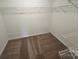 Walk in closet featuring wire shelving and neutral carpet at 3912 Laurel View Cir, Indian Trail, NC 28079