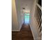 Hallway view to a bright backyard through sliding glass doors at 3912 Laurel View Cir, Indian Trail, NC 28079