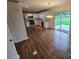 Open kitchen and living area with stainless steel appliances and backyard access at 3912 Laurel View Cir, Indian Trail, NC 28079