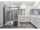 Modern bathroom featuring gray-tiled shower with bench and double sink vanity with gray-tiled flooring at 4015 Havenport Cir, Fort Mill, SC 29708