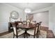 Elegant dining room with a round table, decorative mirror, chandelier lighting, and neutral-toned walls at 4015 Havenport Cir, Fort Mill, SC 29708