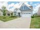 Well-maintained home with attractive landscaping, a spacious driveway, and a two-car garage at 4015 Havenport Cir, Fort Mill, SC 29708