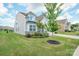 Beautifully landscaped front yard featuring lush green grass and mature trees at 4015 Havenport Cir, Fort Mill, SC 29708