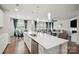Spacious kitchen with island, modern appliances, white cabinets, and an open view to the dining and living areas at 4015 Havenport Cir, Fort Mill, SC 29708