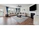 Spacious living room with fireplace, stylish decor, hardwood floors, and lots of natural light at 4015 Havenport Cir, Fort Mill, SC 29708