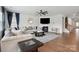 Bright living room with fireplace, ceiling fan, hardwood floors and ample natural light at 4015 Havenport Cir, Fort Mill, SC 29708