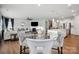 Open-concept living space with fireplace, kitchen, dining area and hardwood floors at 4015 Havenport Cir, Fort Mill, SC 29708