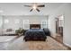 Comfortable main bedroom features a ceiling fan, natural light and ensuite bath at 4015 Havenport Cir, Fort Mill, SC 29708