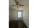 Small bedroom with a ceiling fan and a single window at 407 Lincoln St, Wadesboro, NC 28170