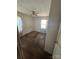 Bedroom with ceiling fan, natural light, and potential for updates at 407 Lincoln St, Wadesboro, NC 28170
