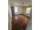 Bedroom showcasing hardwood floors, two windows, and natural light at 407 Lincoln St, Wadesboro, NC 28170