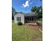 Charming home featuring vinyl siding, a covered front porch, and small landscaped area at 407 Lincoln St, Wadesboro, NC 28170