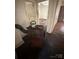 Living room featuring a vintage heater and weathered wood flooring at 407 Lincoln St, Wadesboro, NC 28170