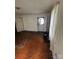 A view of the Living Room showing the hardwood floors and the entry door at 407 Lincoln St, Wadesboro, NC 28170