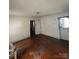 A view of the Living Room showing the hardwood floors and the entry door at 407 Lincoln St, Wadesboro, NC 28170