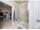 Bright bathroom featuring a glass enclosed shower and walk-in closet access at 4245 Millstream Rd, Denver, NC 28037