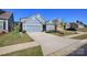 Attractive home with a blue exterior, two-car garage, and a well-kept lawn offers a welcoming facade at 4245 Millstream Rd, Denver, NC 28037