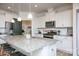 Open kitchen with an island featuring granite countertops, stainless appliances, and abundant storage space at 4245 Millstream Rd, Denver, NC 28037