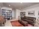 Spacious living room with a comfortable couch, bookshelf, and stylish decor at 4245 Millstream Rd, Denver, NC 28037