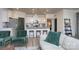 Open-concept living area with a modern kitchen, island seating, and a comfortable living space at 4245 Millstream Rd, Denver, NC 28037