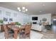 Bright living room with a fireplace, a large TV, modern furniture and plenty of natural light at 4245 Millstream Rd, Denver, NC 28037