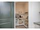 Well-organized pantry featuring multiple shelves, ample storage space, and easy accessibility for groceries at 4245 Millstream Rd, Denver, NC 28037