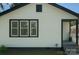 Home showcasing siding and black trim, offering curb appeal and a touch of modern elegance at 443 Brandon St, Davidson, NC 28036