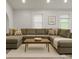 Spacious living room featuring hardwood floors, neutral walls, a sectional sofa, and recessed lighting at 443 Brandon St, Davidson, NC 28036