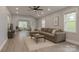 Spacious living room with an archway, neutral sectional sofa, and large windows offering natural light at 443 Brandon St, Davidson, NC 28036