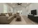 Spacious living room featuring hardwood floors, neutral walls, a sectional sofa, and recessed lighting at 443 Brandon St, Davidson, NC 28036