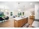 Bright eat-in kitchen with stainless appliances, a large island and modern pendant lighting at 4547 Kings Ct, Hickory, NC 28602