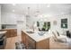 Bright eat-in kitchen with stainless appliances, a large island and modern pendant lighting at 4547 Kings Ct, Hickory, NC 28602