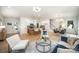 Open-concept living area with dining table and chairs, bright windows and hardwood floors at 4547 Kings Ct, Hickory, NC 28602