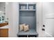 Stylish mudroom with a built-in bench, storage cubbies, and decorative pillows at 4547 Kings Ct, Hickory, NC 28602