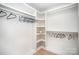 Spacious walk-in closet with ample storage, built-in shelving, and natural light at 4547 Kings Ct, Hickory, NC 28602
