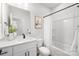 Well-lit bathroom featuring modern vanity and shower-tub combination with stylish white curtain at 4815 & 4817 Victoria Dr, Charlotte, NC 28269