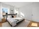 Bright bedroom with natural light, neutral tones, and wood-look flooring at 4815 & 4817 Victoria Dr, Charlotte, NC 28269