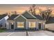 Charming exterior view of the newly built property, featuring neutral siding and modern architectural details at 4815 & 4817 Victoria Dr, Charlotte, NC 28269
