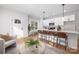 Open-concept kitchen featuring a large island with seating, white cabinets, and stainless steel appliances at 4815 & 4817 Victoria Dr, Charlotte, NC 28269