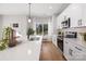 Spacious kitchen featuring an island with seating, modern appliances, and plenty of natural light from the windows at 4815 & 4817 Victoria Dr, Charlotte, NC 28269