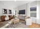 Stylish living room with comfortable leather sofa, modern decor, and a large window for natural light at 4815 & 4817 Victoria Dr, Charlotte, NC 28269