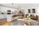 Open-concept living space featuring a modern kitchen, dining area, and stylish living room at 4815 & 4817 Victoria Dr, Charlotte, NC 28269