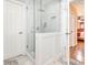 Newly remodeled bathroom with a glass-enclosed shower, clean white tile, and neutral color palette at 5417 Bedfordshire Ave, Harrisburg, NC 28075