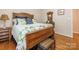 A cozy bedroom with a wooden bed frame, decorative pillows, and a lovely vintage trunk at 5417 Bedfordshire Ave, Harrisburg, NC 28075